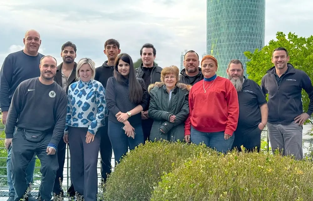 Group photo of Safety Line employees at the team barbecue.